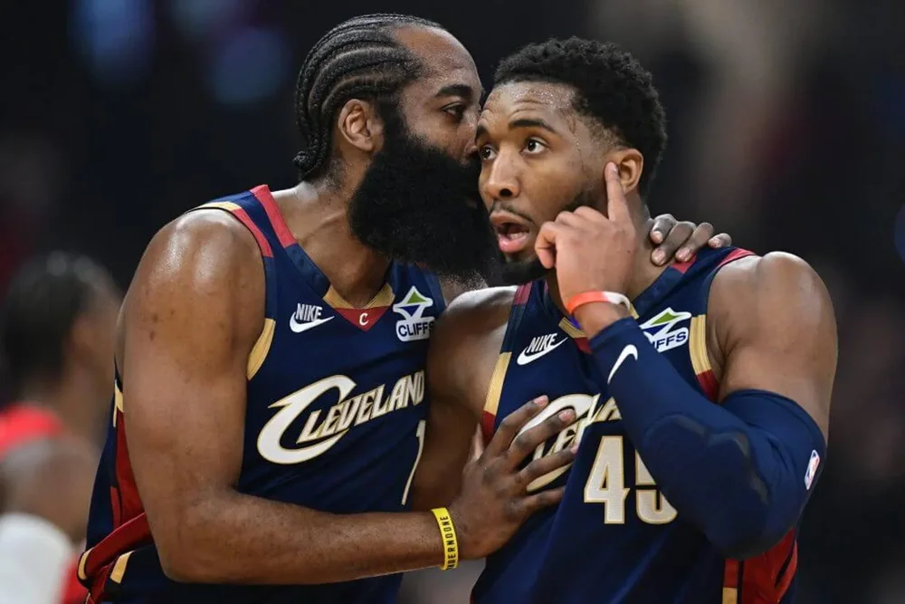 James Harden speaks to Donovan Mitchell